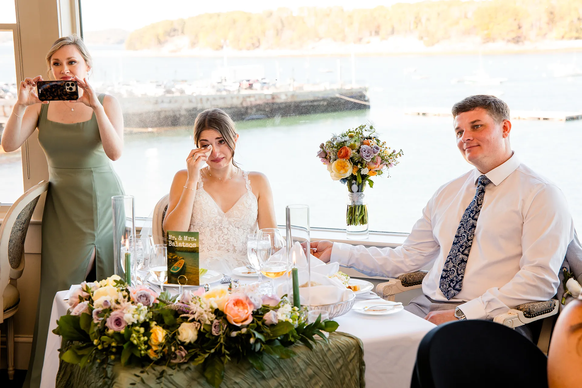 A bride cries while she listens to a toast during a wedding reception at the Bar Harbor Inn and Spa near Acadia National Park in Maine.
