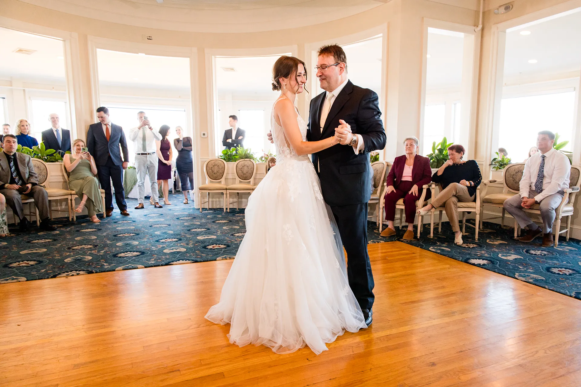 A bride and her dad share a dance during a wedding reception at the Bar Harbor Inn and Spa near Acadia National Park in Maine.