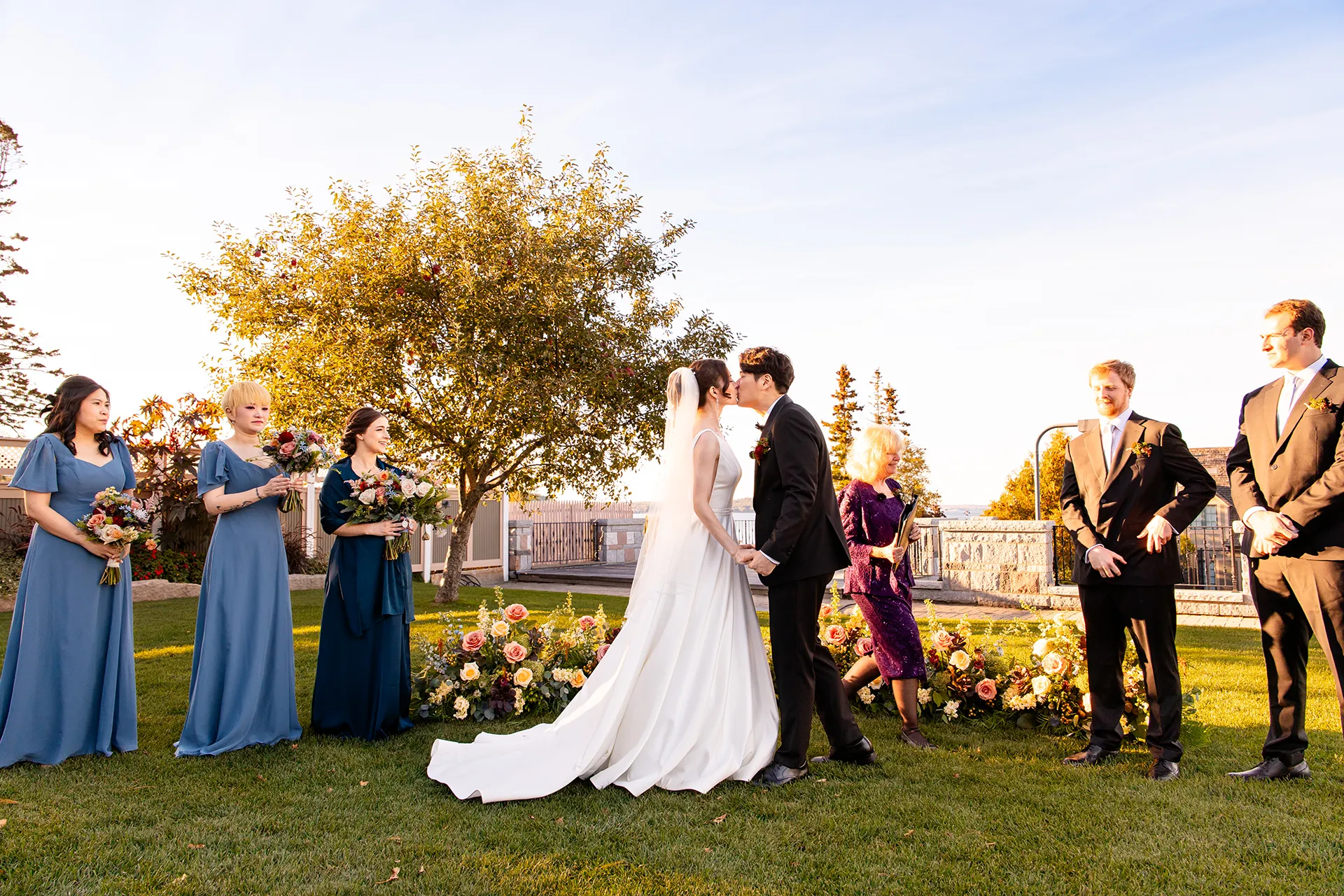 A bride and groom kiss during a wedding ceremony at the Bar Harbor Club near Acadia National Park in Maine.