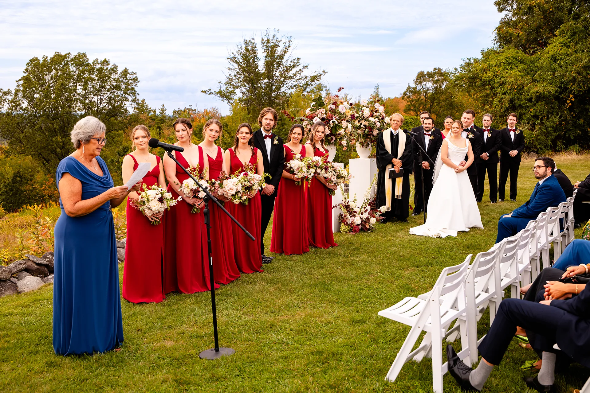 A woman gives a reading as a bride and groom listen during a wedding ceremony at Fruitlands Museum in Harvard Massachusetts.