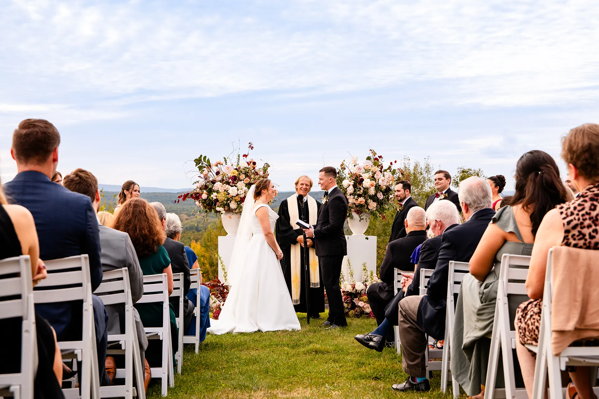A groom reads his vows to a bride during a wedding ceremony at Fruitlands Museum in Harvard Massachusetts.