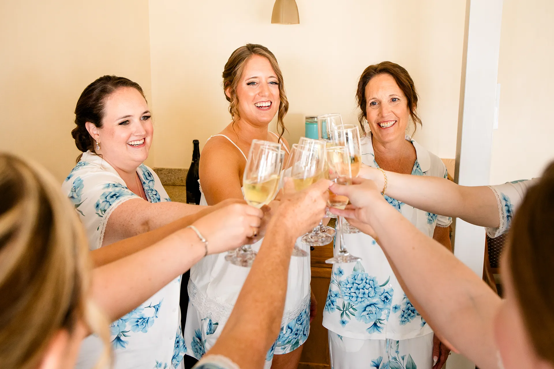 maine wedding photography meghan phil 10 A bride toasts with her mom and bridesmaids at the Atlantic Oceanside Hotel and Event Center in Bar Harbor, Maine.