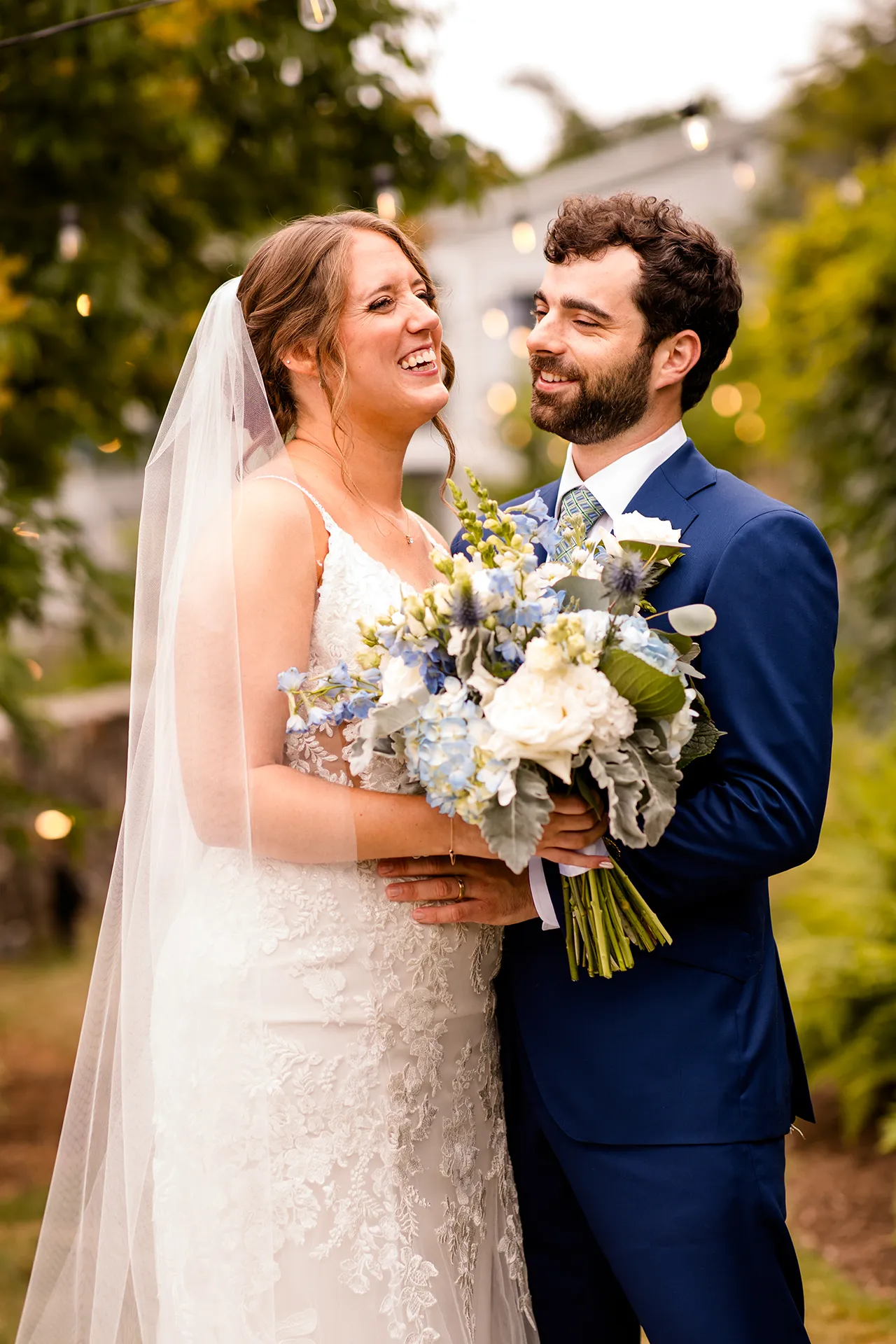 maine wedding photography meghan phil 26 A bride and groom laugh together during wedding portraits at the Atlantic Oceanside Hotel & Event Center in Bar Harbor, Maine.
