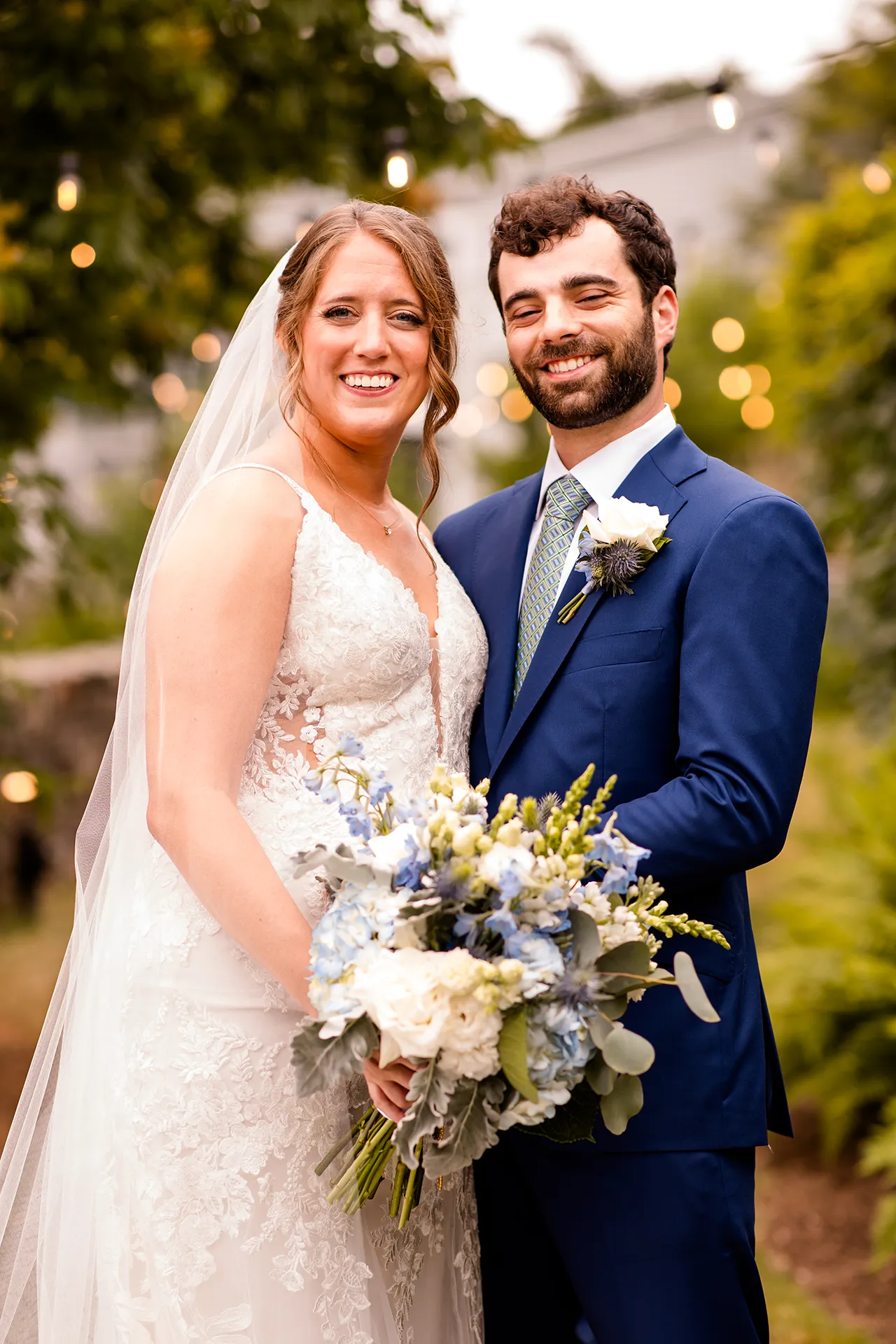 maine wedding photography meghan phil 27 A bride and groom smile and pose during wedding portraits in the garden at the Atlantic Oceanside Hotel & Event Center in Bar Harbor, Maine.