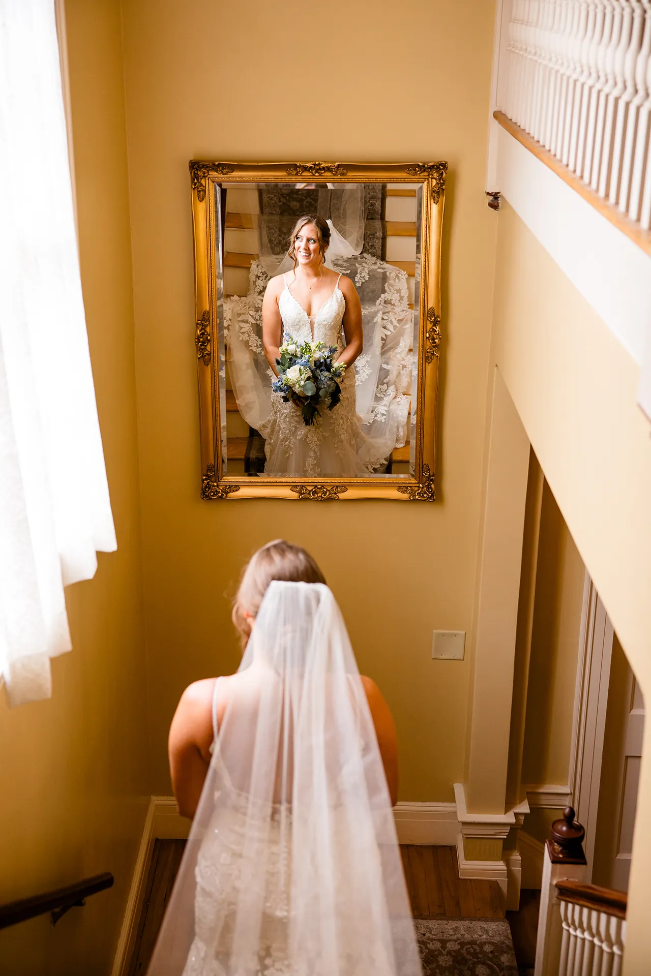 maine wedding photography meghan phil 29 A bride smiles as she is reflected in a mirror at the Willows on the property of the Atlantic Oceanside Hotel & Event Center in Bar Harbor, Maine.
