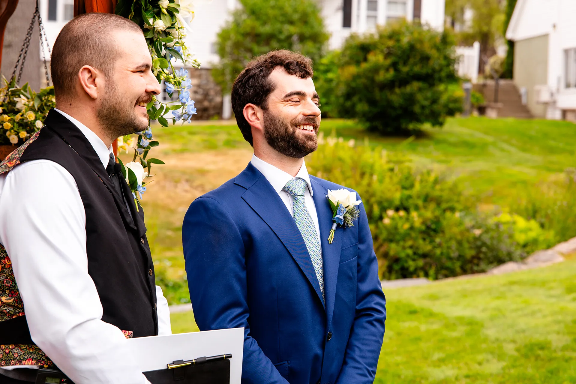 maine wedding photography meghan phil 30 A groom smiles as a bride walks down the aisle during a wedding ceremony at the Atlantic Oceanside Hotel & Event Center in Bar Harbor, Maine.