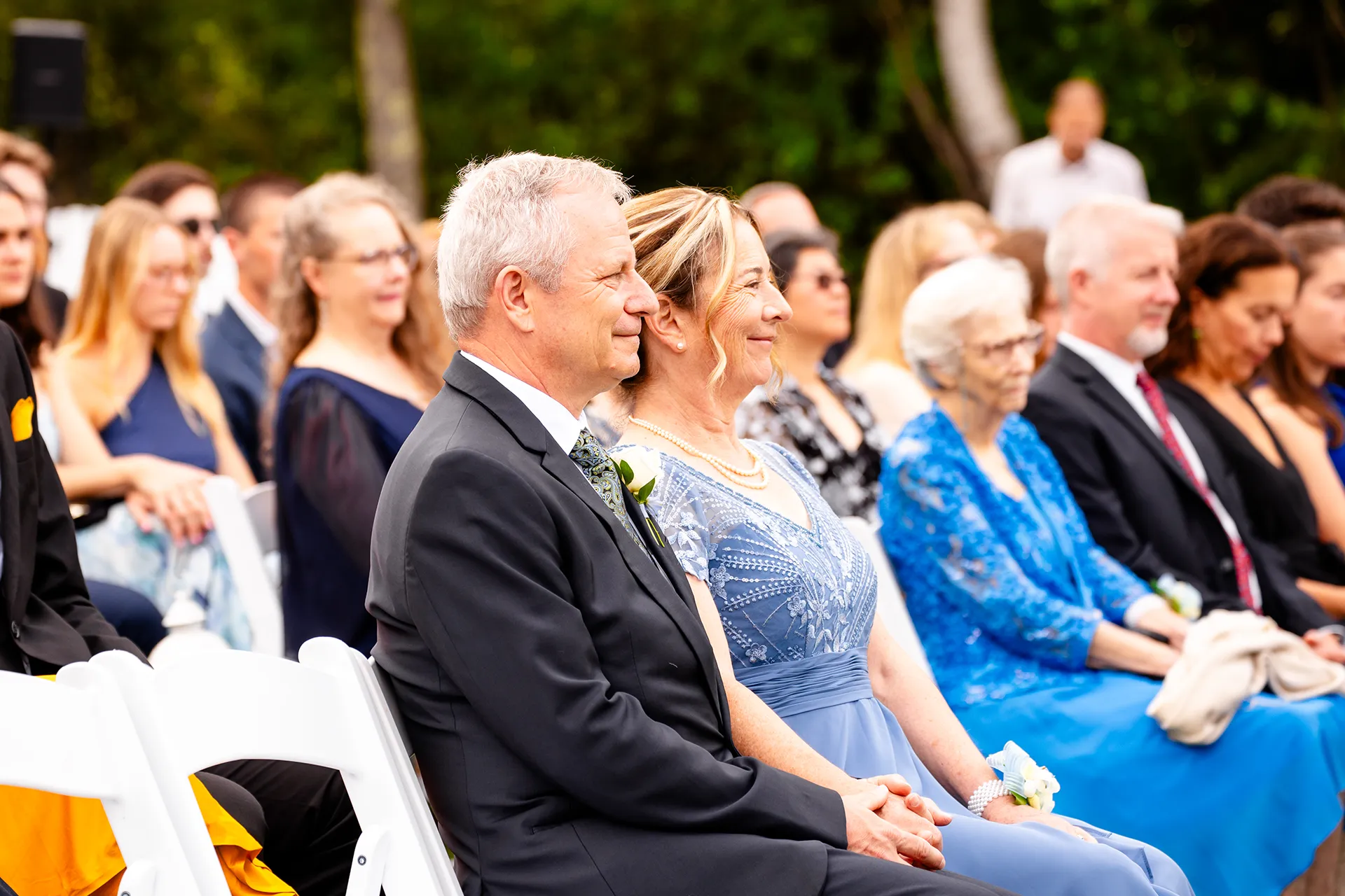 maine wedding photography meghan phil 35 Parents hold hands and watch a wedding ceremony at the Atlantic Oceanside Hotel & Event Center in Bar Harbor, Maine.