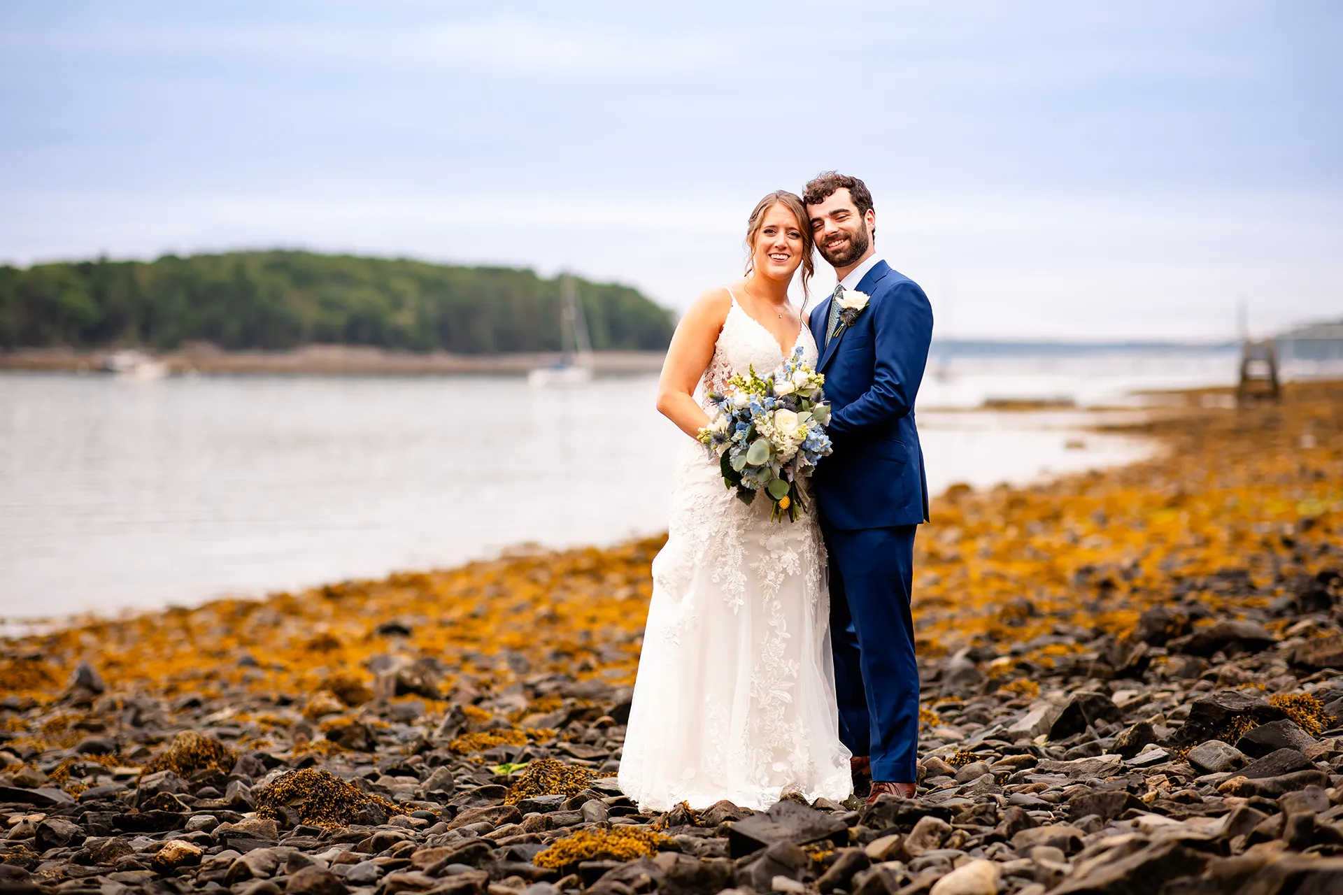 maine wedding photography meghan phil 48 A newly married couple smile and pose during beach portraits at the Atlantic Oceanside Hotel & Event Center in Bar Harbor, Maine.