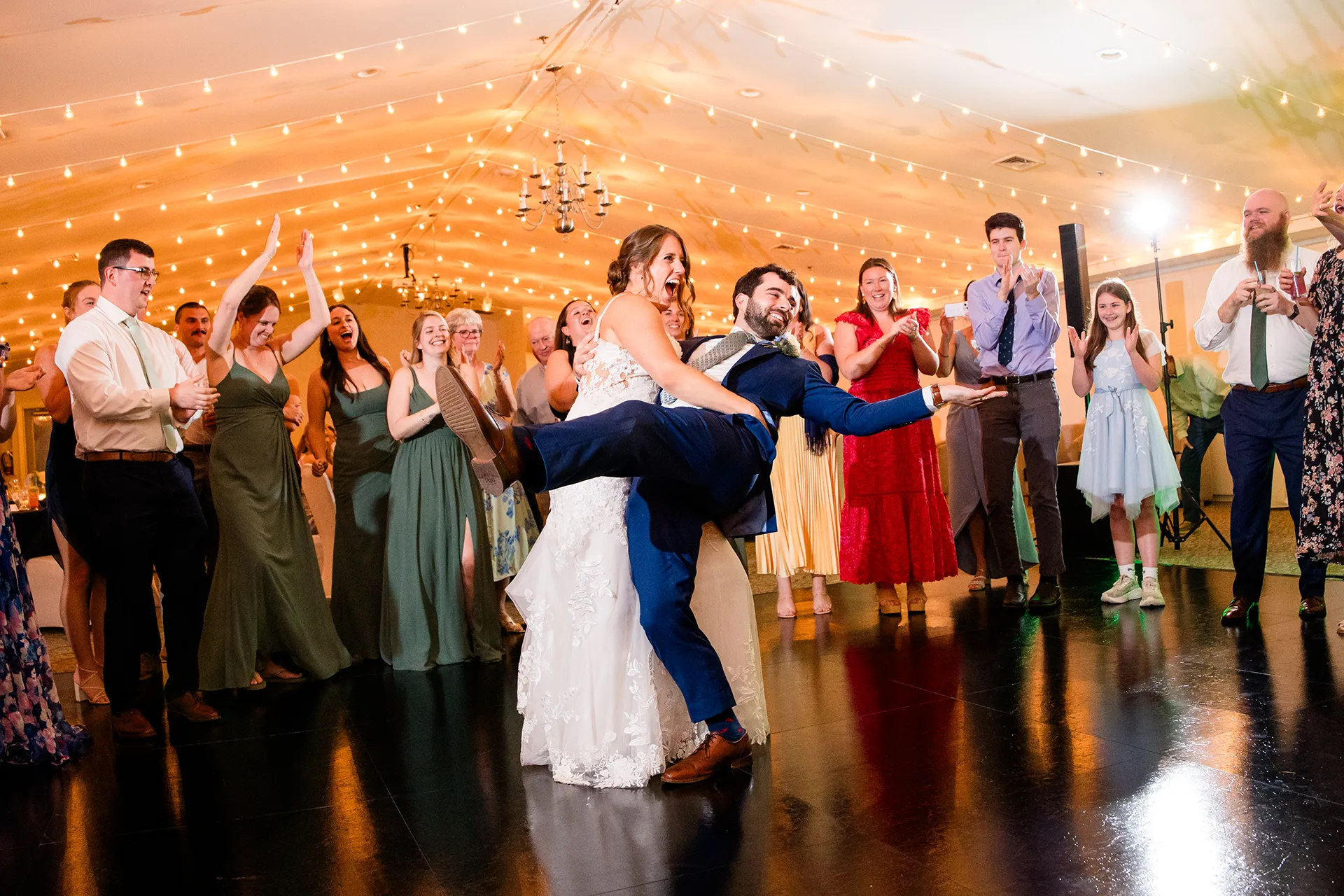 maine wedding photography meghan phil 57 A bride dips a groom during a wedding reception at the Atlantic Oceanside Hotel & Event Center in Bar Harbor, Maine.