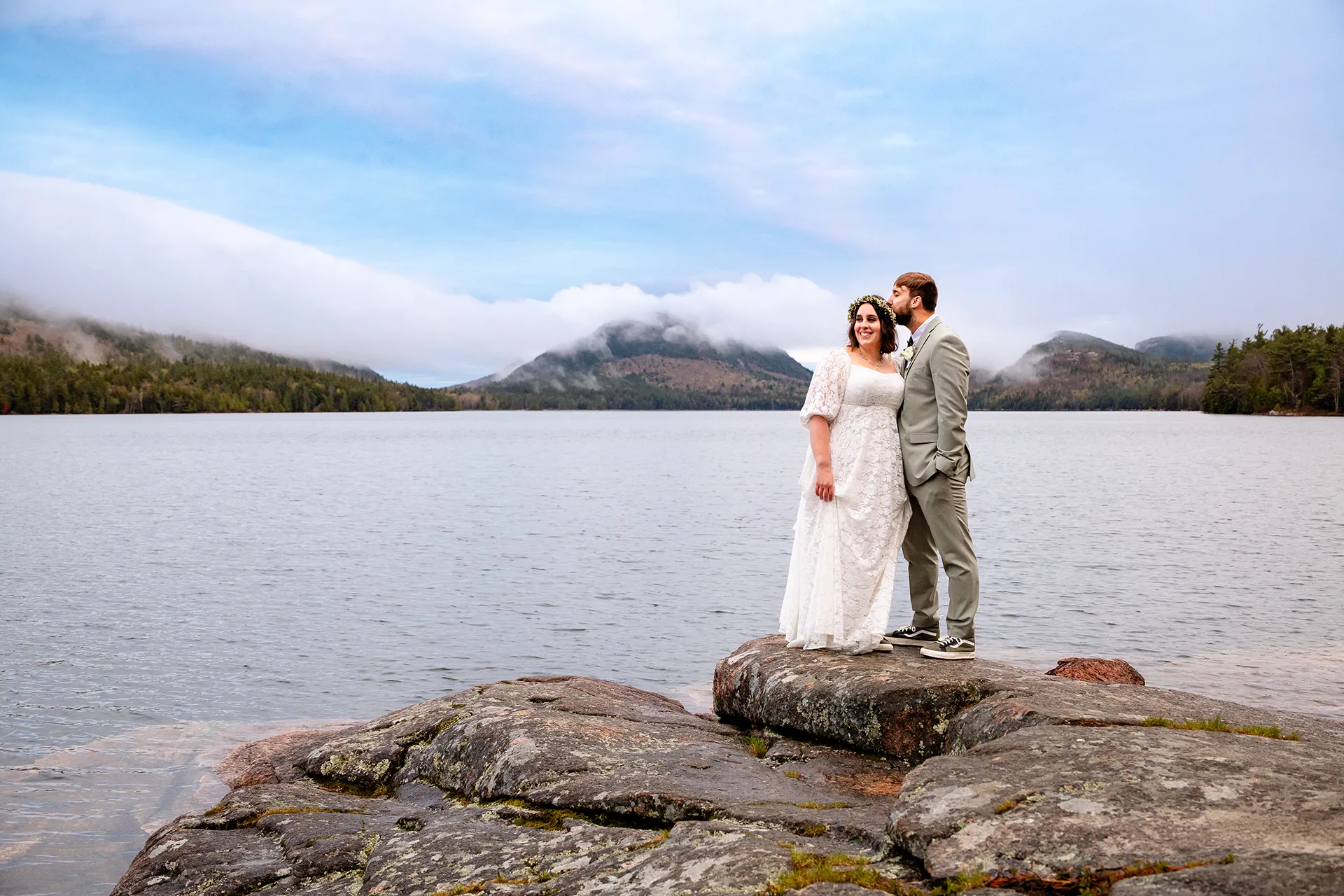 maine wedding photography mystic andrew 12 A groom kisses a smiling bride on the head during wedding portraits at Eagle Lake in Acadia National Park near Bar Harbor, Maine.