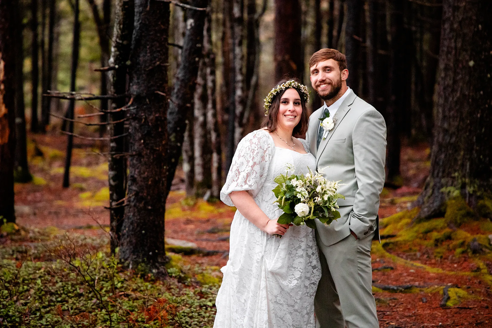 maine wedding photography mystic andrew 16 A bride and groom smile and pose in the woods during wedding portraits at Eagle Lake in Acadia National Park near Bar Harbor, Maine.