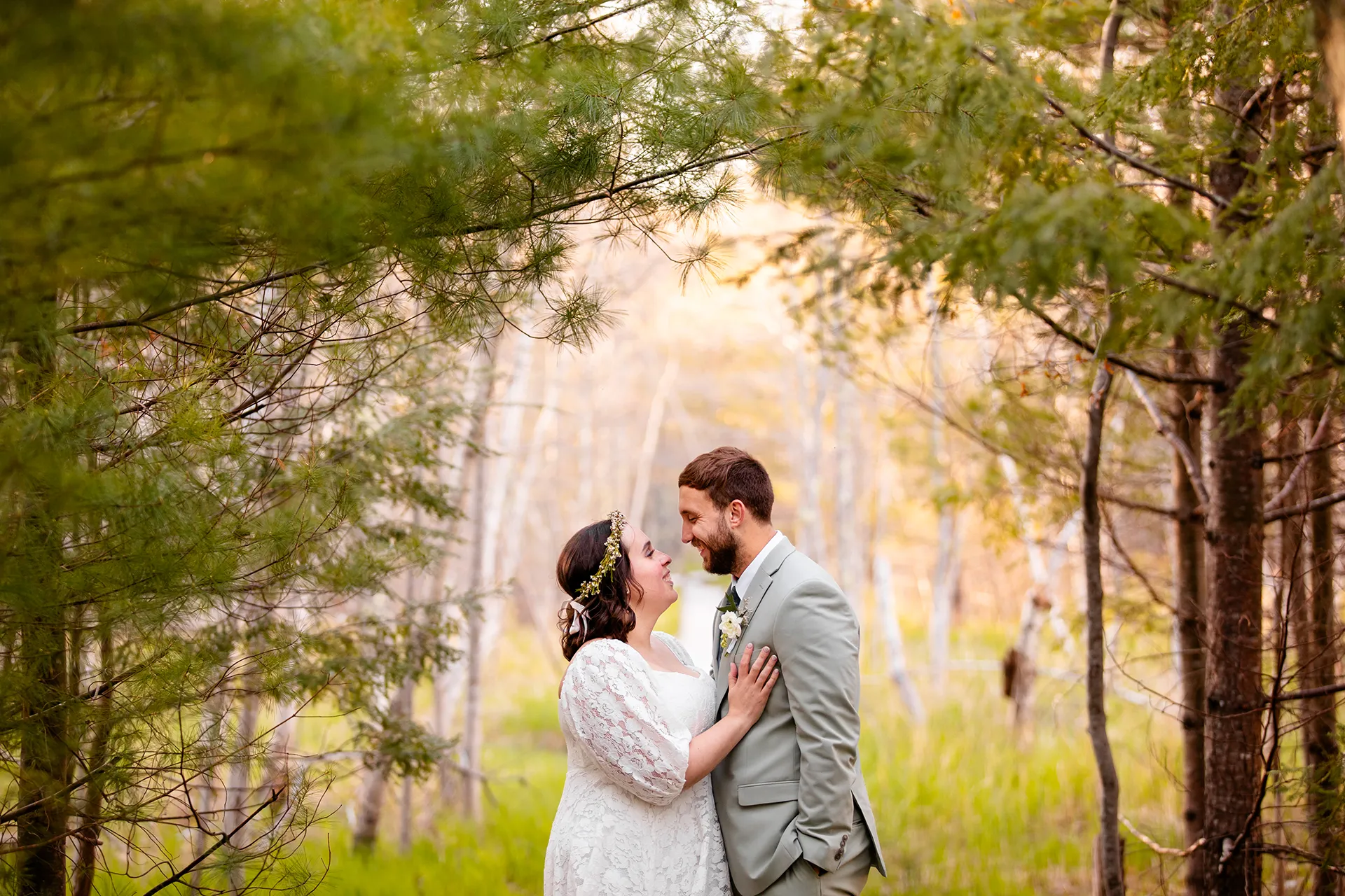 maine wedding photography mystic andrew 20 A bride and groom smile at each other during wedding portrait on the Jesup Path in Acadia National Park near Bar Harbor, Maine.