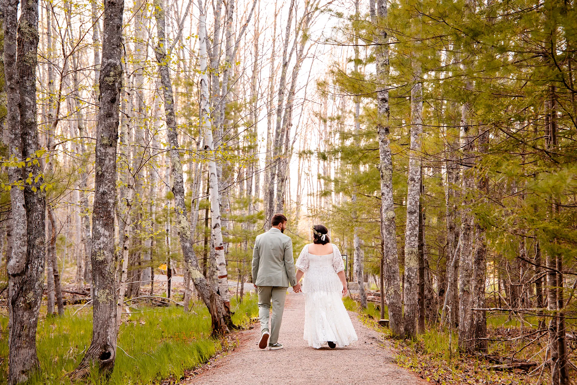 maine wedding photography mystic andrew 21 A newly married hold hands as they walk along the Hemlock Trail in Acadia National Park near Bar Harbor, Maine.
