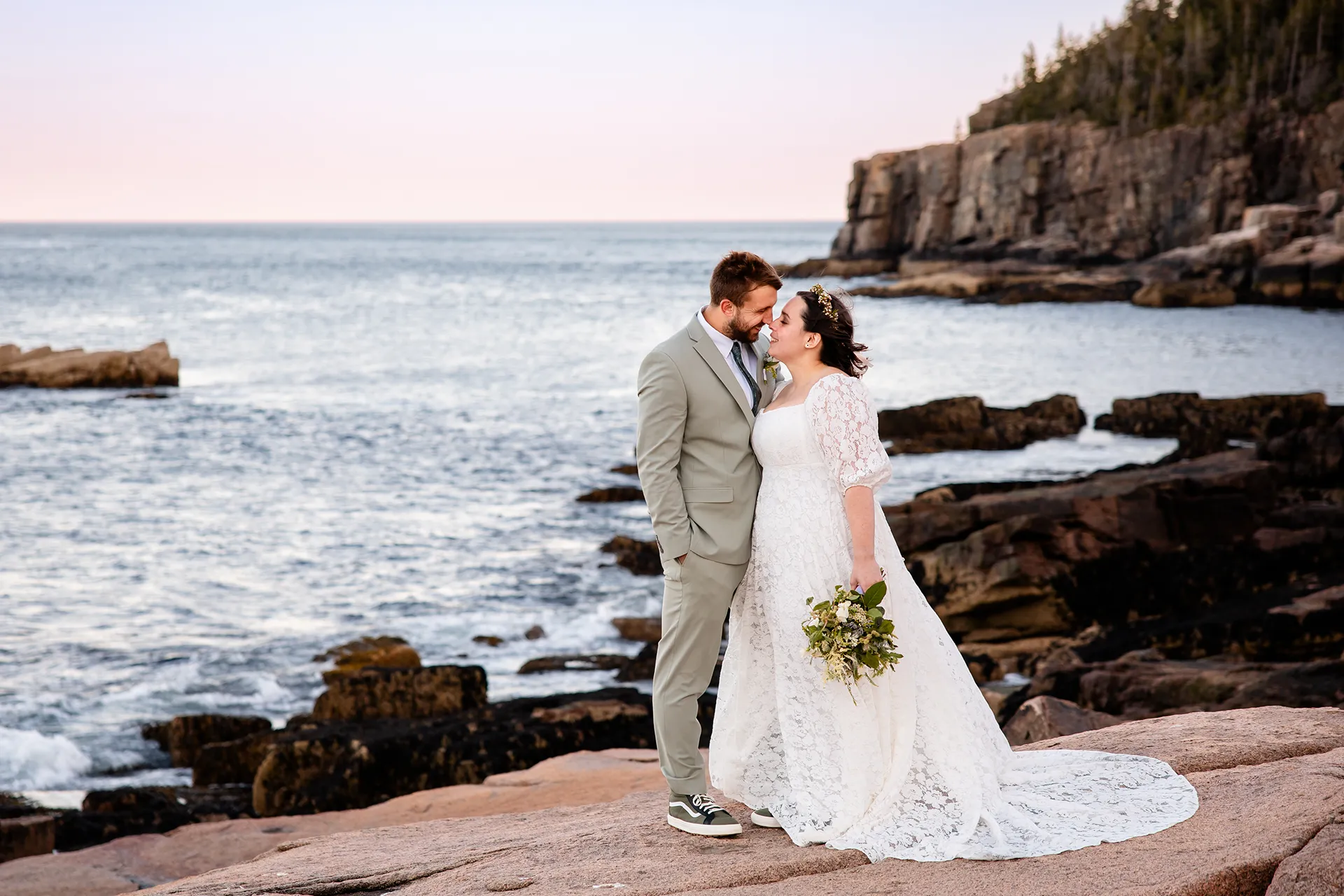 maine wedding photography mystic andrew 28 A newly married couple rub noses during wedding portraits near Otter Cliff at Acadia National Park in Bar Harbor, Maine.