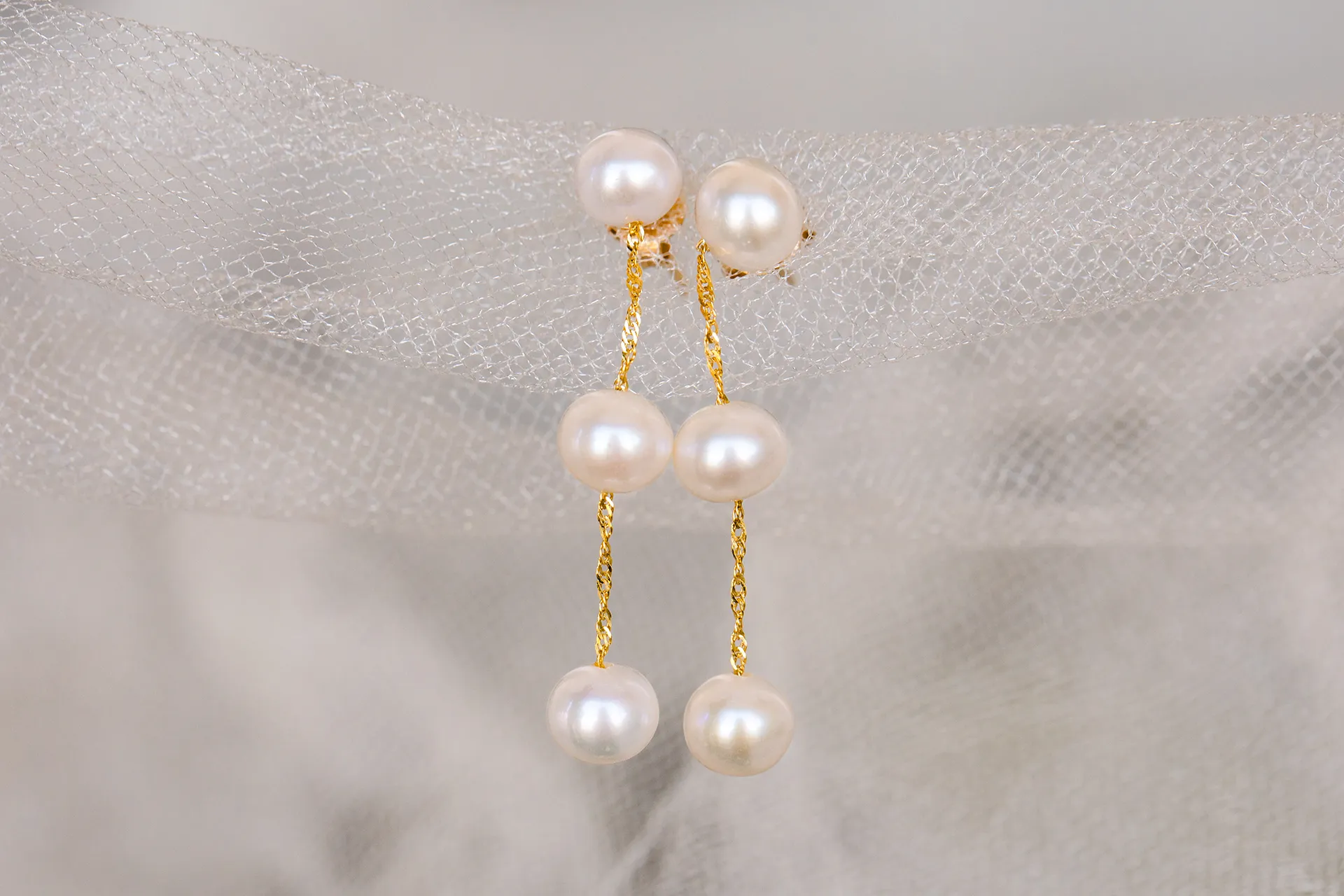 A closeup of pearl earrings for a wedding at the Bar Harbor Inn and Spa in Bar Harbor, Maine.