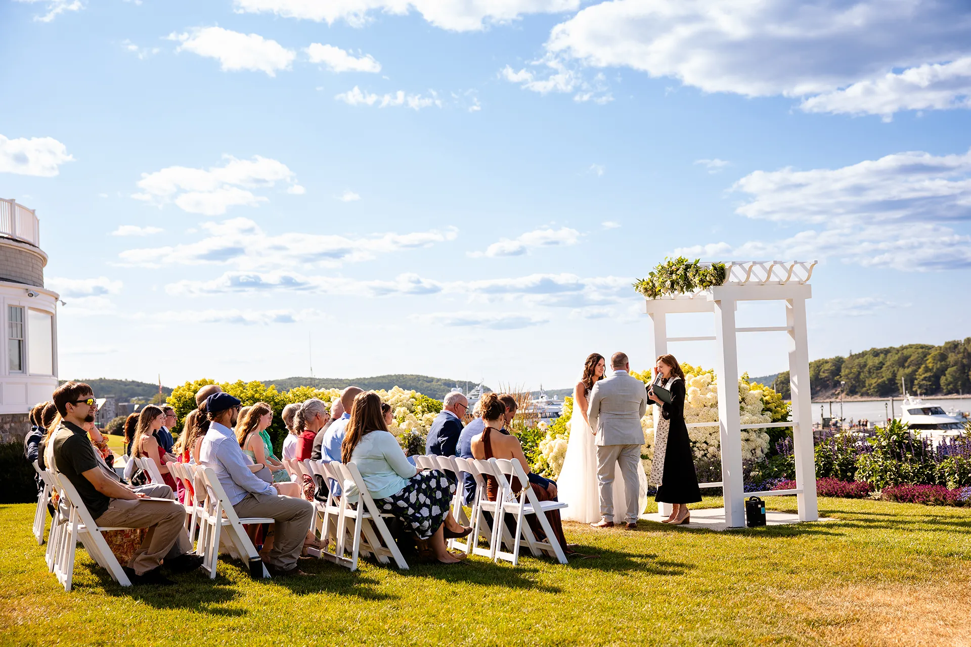 Guests watch a wedding ceremony at the Bar Harbor Inn and Spa in Bar Harbor, Maine.