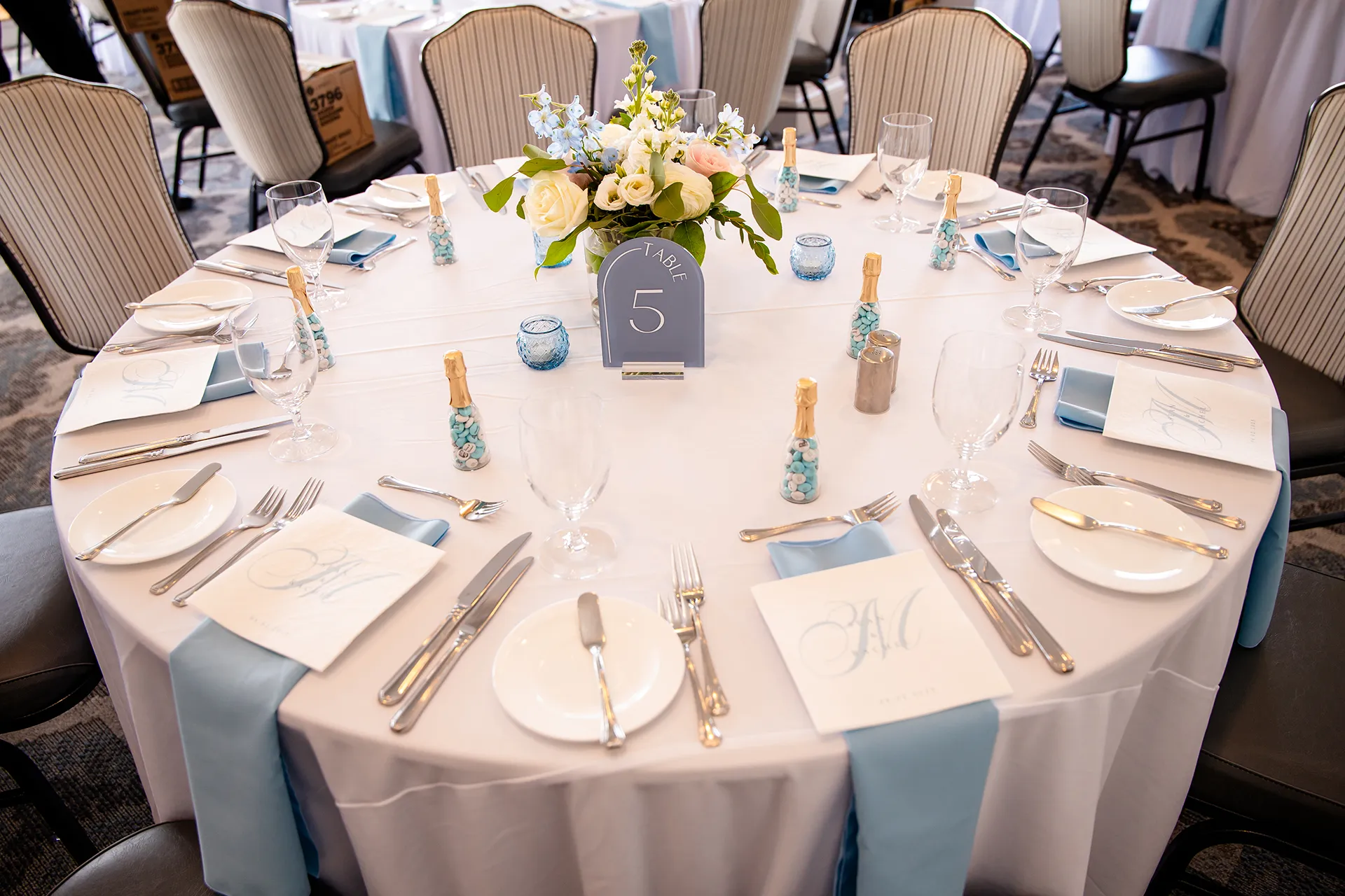 A closeup of a table setting for a wedding reception in the Porcupine Room at the Bar Harbor Inn and Spa in Bar Harbor, Maine.