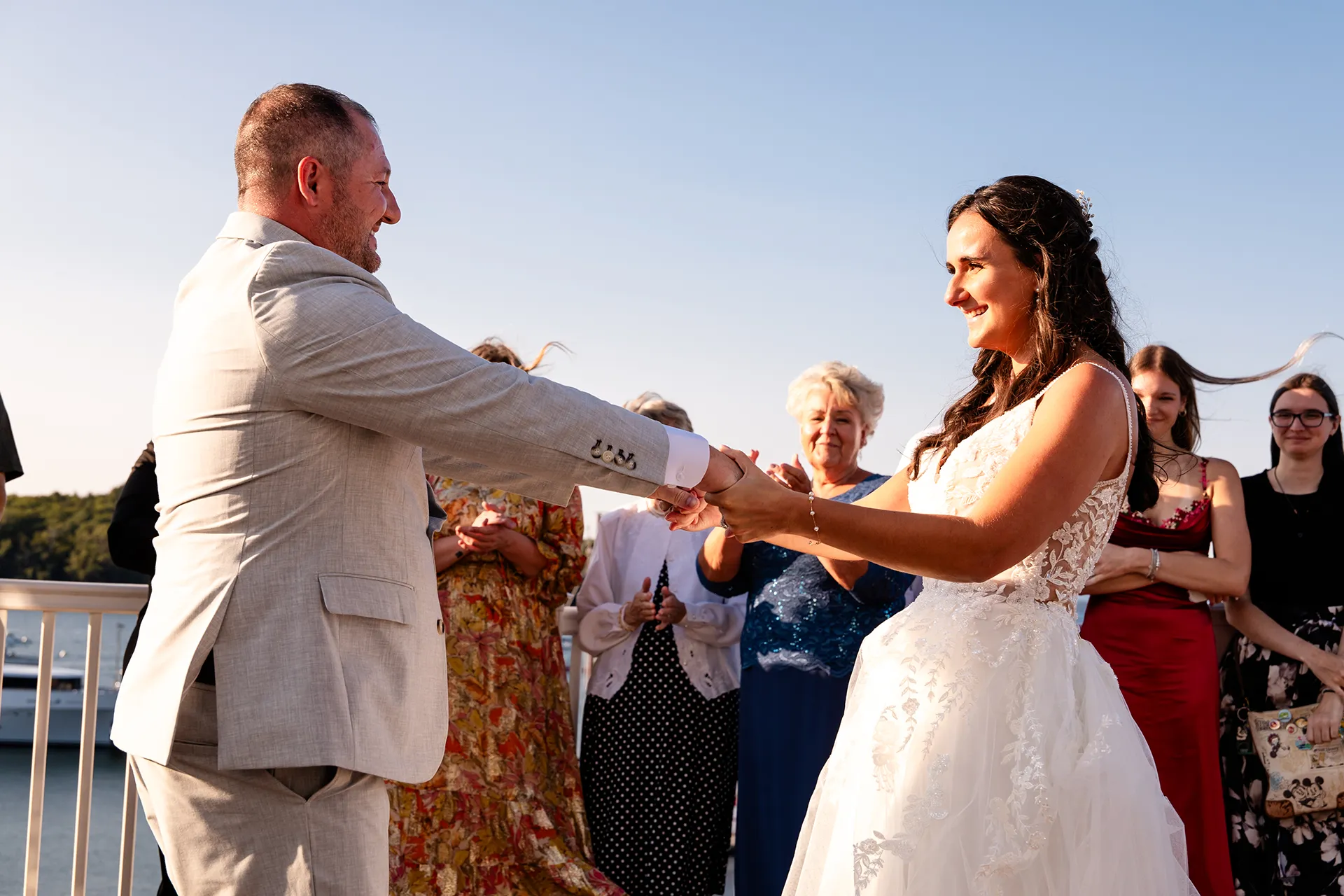 A bride and groom share a first dance on the deck of the Porcupine Room at the Bar Harbor Inn and Spa in Bar Harbor, Maine.