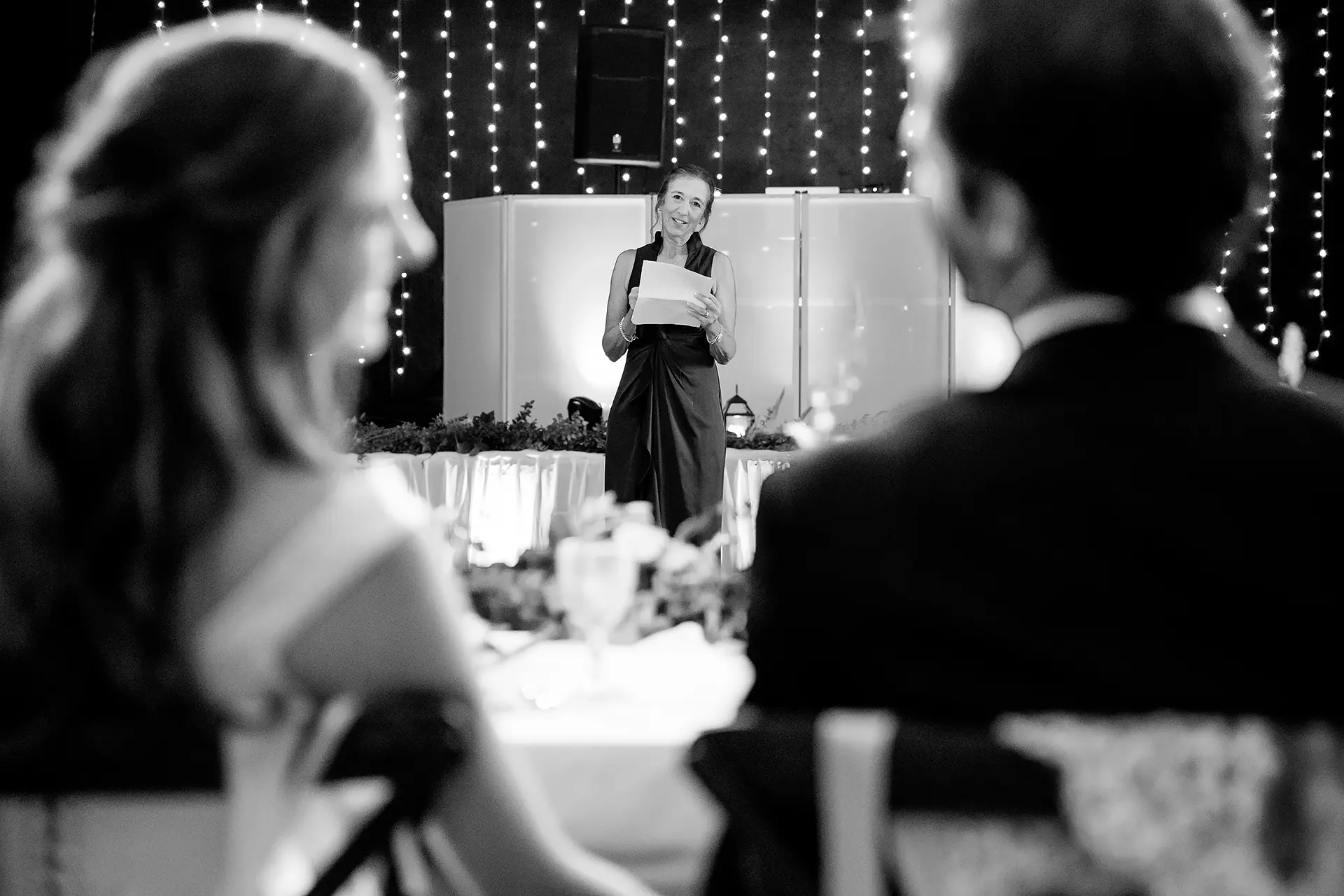 A mom gives a toast during a wedding reception at Kingsley Pines Camp in Raymond, Maine.