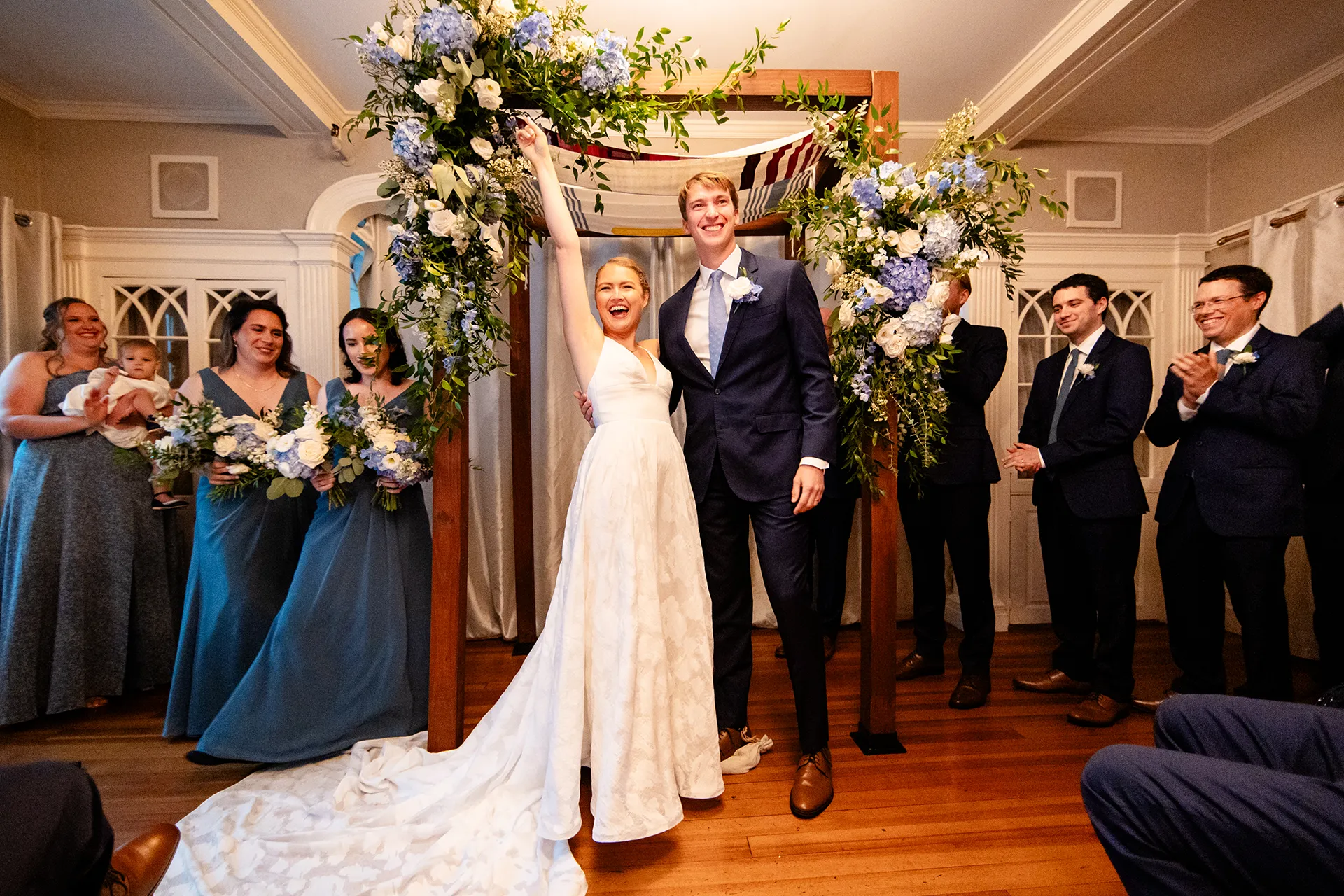 A bride and groom celebrate after getting married at the Nonantum Resort in Kennebunkport, Maine.