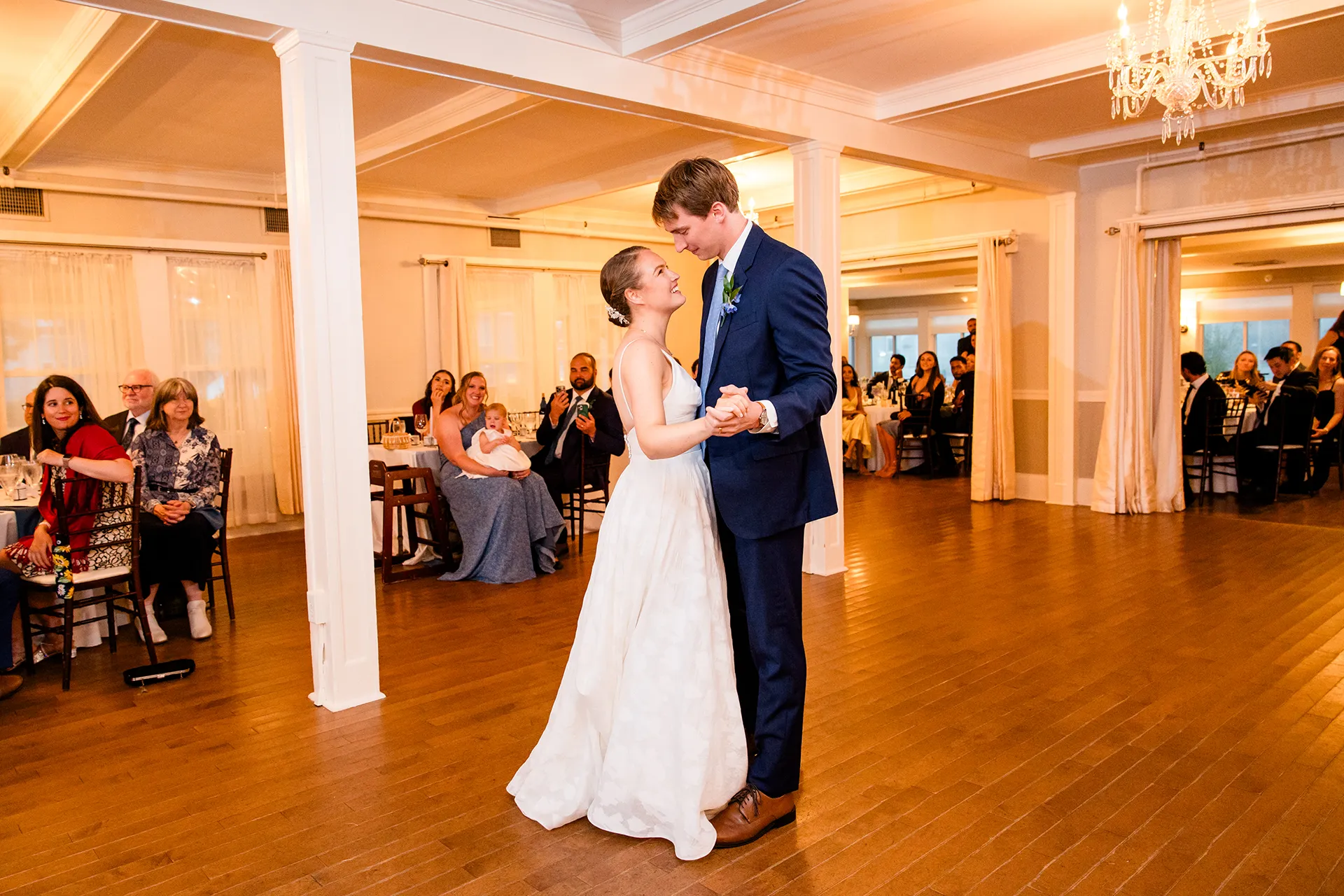 A bride and groom share a first dance during a wedding reception at the Nonantum Resort in Kennebunkport, Maine.
