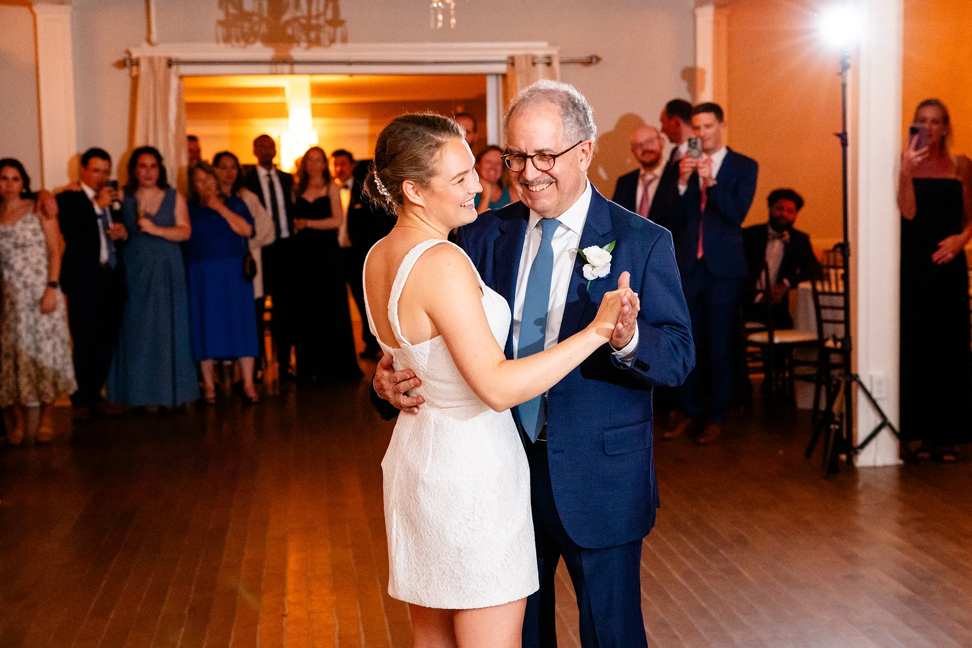 A bride shares a dance with her dad during a wedding reception at the Nonantum Resort in Kennebunkport, Maine.