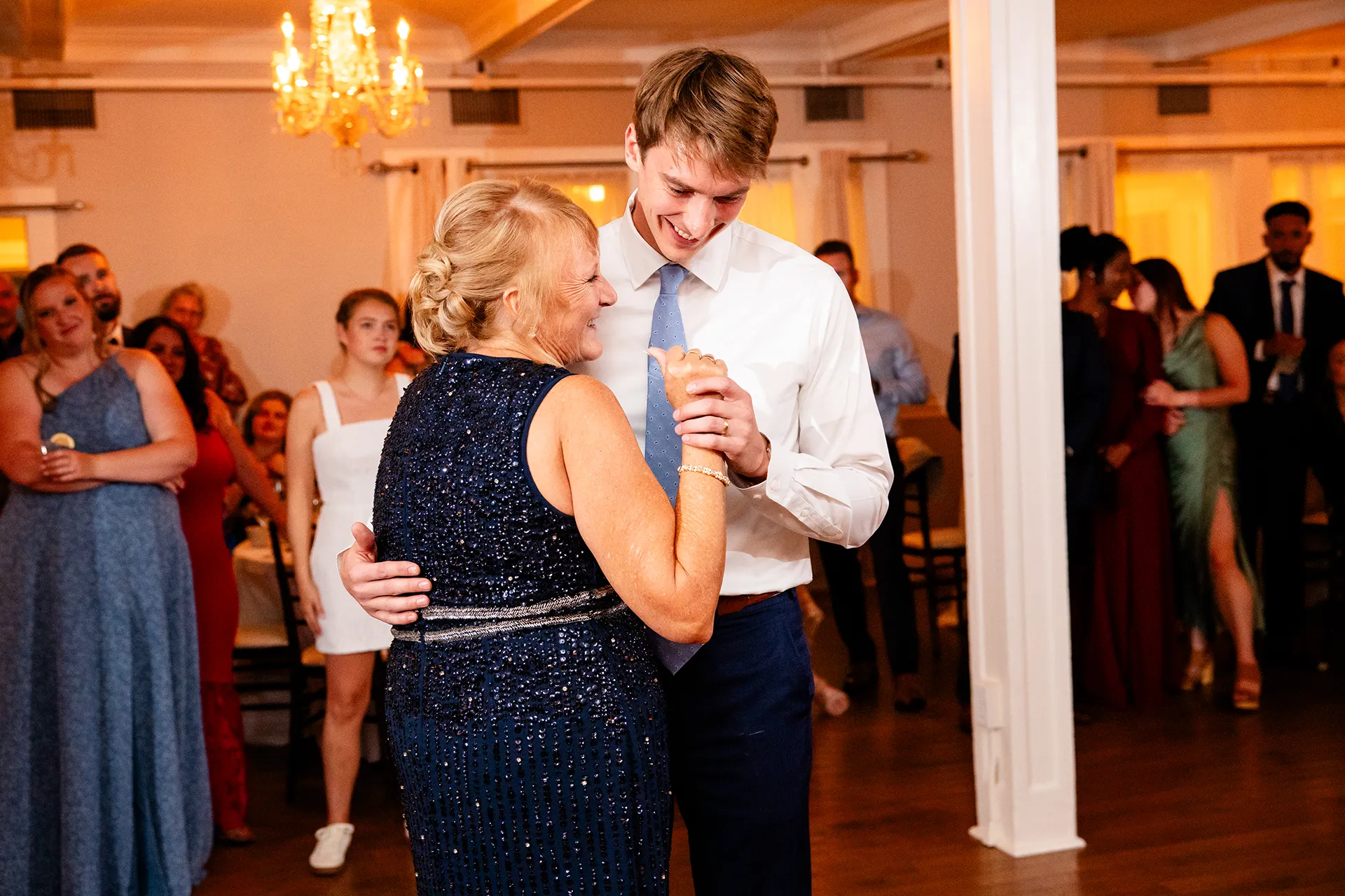 A groom shares a dance with his mom during a wedding reception at the Nonantum Resort in Kennebunkport, Maine.